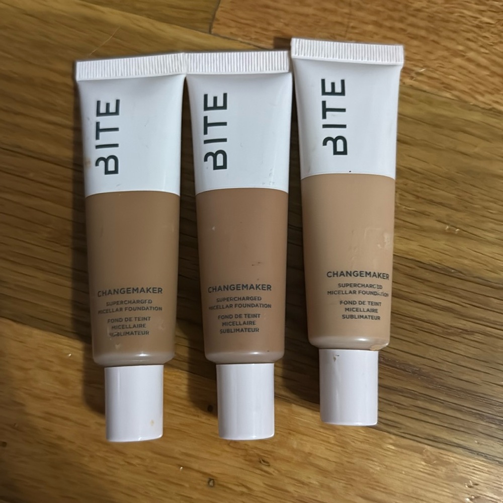 Three different shades of foundations all about 75% full
